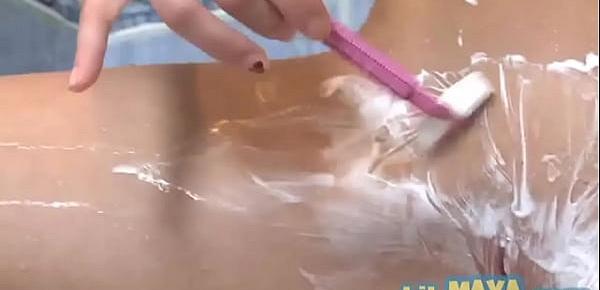 Small teen showers and shaves her pussy